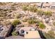 Overhead view of an enclosed patio area with desert landscaping and a small seating area at 8142 S Open Trail Ln, Gold Canyon, AZ 85118