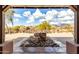 Scenic courtyard featuring a rock water feature and view of the surrounding desert at 8142 S Open Trail Ln, Gold Canyon, AZ 85118