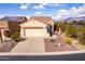 Aerial view of a charming single-story home with desert landscaping and an attached two-car garage at 8142 S Open Trail Ln, Gold Canyon, AZ 85118