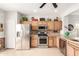 Modern kitchen with stainless steel appliances, light cabinets, and a bright atmosphere at 8142 S Open Trail Ln, Gold Canyon, AZ 85118