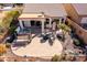 Aerial view of patio area featuring a hot tub, desert landscaping, and comfortable seating at 8142 S Open Trail Ln, Gold Canyon, AZ 85118