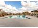 The community swimming pool offers a refreshing outdoor oasis with lounge chairs and scenic desert views at 8142 S Open Trail Ln, Gold Canyon, AZ 85118