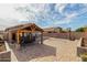 Backyard showcases a pergola, volleyball court, and paved area for outdoor activities at 8204 W Tonto Ln, Peoria, AZ 85382