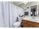 This bathroom features a toilet and a sink with modern fixtures at 8204 W Tonto Ln, Peoria, AZ 85382