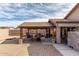 Cozy outdoor patio area with a charming wooden pergola, ideal for entertaining and relaxation at 8204 W Tonto Ln, Peoria, AZ 85382