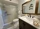 Bright bathroom featuring a marble countertop, updated fixtures, and a glass-enclosed shower at 8410 N 32Nd Ave, Phoenix, AZ 85051