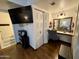 Versatile bedroom with vanity, closet, and sleek laminate flooring at 8410 N 32Nd Ave, Phoenix, AZ 85051