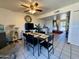 Open-concept dining area with tile floors, modern lighting, and seamless flow to other living spaces at 8410 N 32Nd Ave, Phoenix, AZ 85051