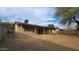 Expansive backyard featuring a covered patio, perfect for outdoor entertaining and relaxation at 8815 W Columbus Ave, Phoenix, AZ 85037