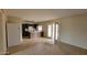 A view of the kitchen featuring dark cabinets, white appliances, and an airy atmosphere at 8815 W Columbus Ave, Phoenix, AZ 85037