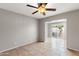 Bright, neutral bedroom features a ceiling fan and opens up to an outdoor area at 934 E Cochise Dr, Phoenix, AZ 85020