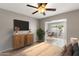 Bedroom features a ceiling fan, neutral colors, and a sliding glass door to the outside at 934 E Cochise Dr, Phoenix, AZ 85020