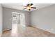 Bright, neutral bedroom features a ceiling fan and shutters at 934 E Cochise Dr, Phoenix, AZ 85020