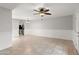 Bright living room features neutral paint and a ceiling fan at 934 E Cochise Dr, Phoenix, AZ 85020