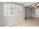 Living room features tile floors, bright windows, and a view to the bathroom at 934 E Cochise Dr, Phoenix, AZ 85020