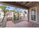 Private patio featuring mature landscaping and brick pavers, providing an ideal outdoor space at 934 E Cochise Dr, Phoenix, AZ 85020