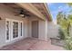 Outdoor patio with comfortable seating, ceiling fan, and attractive landscaping at 934 E Cochise Dr, Phoenix, AZ 85020