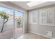 Bright sunroom with tile floors and sliding glass doors to an outdoor courtyard at 934 E Cochise Dr, Phoenix, AZ 85020