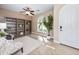 Bright home office features arched window, ceiling fan, and built-in shelving units at 964 S Henry Ln, Gilbert, AZ 85296