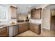 Corner kitchen view featuring wooden cabinets, granite countertops, stainless steel appliances, and tiled backsplash at 964 S Henry Ln, Gilbert, AZ 85296