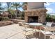 Outdoor fireplace with seating area, perfect for gatherings and relaxation at 964 S Henry Ln, Gilbert, AZ 85296