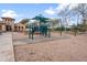 Community playground with modern equipment and shade structures at 964 S Henry Ln, Gilbert, AZ 85296