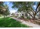 Landscaped street view showcasing the architectural style of the homes and well-kept lawns at 964 S Henry Ln, Gilbert, AZ 85296