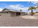 A home's backyard boasts gravel groundcover and a covered patio at 9703 W Forrester Dr, Sun City, AZ 85351