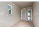 Inviting front entryway with decorative tile, secure screen door, and sidelight providing ample natural light at 9703 W Forrester Dr, Sun City, AZ 85351