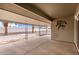 Covered patio with concrete floors and decorative wrought iron supports at 9703 W Forrester Dr, Sun City, AZ 85351