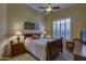 Inviting bedroom featuring a comfortable bed, warm lighting, and a seating area at 9785 E Preserve Way, Scottsdale, AZ 85262