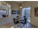 Cozy dining area with a round table, stylish chairs, and sliding glass doors to the outdoor space at 9785 E Preserve Way, Scottsdale, AZ 85262