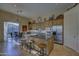 Modern kitchen with stainless steel appliances, granite countertops, and a center island with seating at 9785 E Preserve Way, Scottsdale, AZ 85262