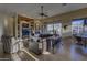 Open living room with a ceiling fan, large windows, and stylish decor accents at 9785 E Preserve Way, Scottsdale, AZ 85262