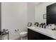 Modern bathroom featuring a sleek black vanity, white countertop, and stylish black fixtures at 100 W Northern Ave # 17, Phoenix, AZ 85021
