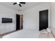 Cozy bedroom with a minimalist design and a black accent door at 100 W Northern Ave # 17, Phoenix, AZ 85021