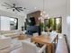 Bright, open living space featuring hardwood floors, a modern fireplace, and a dining area with a wooden table at 100 W Northern Ave # 17, Phoenix, AZ 85021
