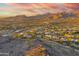 Expansive aerial view of the community and homes under a beautiful sunset sky at 10396 N 133Rd St, Scottsdale, AZ 85259