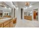 Spacious bathroom with double vanities, elegant chandelier, and tile flooring at 10396 N 133Rd St, Scottsdale, AZ 85259