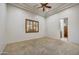 Neutral bedroom offering a ceiling fan and a shuttered window at 10396 N 133Rd St, Scottsdale, AZ 85259