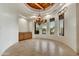 Elegant dining room with coffered ceiling, decorative chandelier, and three large windows showcasing outdoor views at 10396 N 133Rd St, Scottsdale, AZ 85259