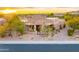Stunning home with desert landscaping, iron gate, and paver walkway at sunset at 10396 N 133Rd St, Scottsdale, AZ 85259