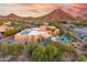 Expansive desert estate with mountain views, solar panels, and lush backyard at 10396 N 133Rd St, Scottsdale, AZ 85259