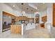 Spacious kitchen with wooden cabinets, granite countertops, travertine floor and stainless steel appliances at 10396 N 133Rd St, Scottsdale, AZ 85259
