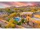 Backyard oasis with luxurious pool, spa, lush landscaping, and mountain views at 10396 N 133Rd St, Scottsdale, AZ 85259