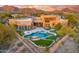 Resort-style backyard with pool, spa, and lush landscaping with mountain views at 10396 N 133Rd St, Scottsdale, AZ 85259