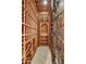 Custom wine cellar with wooden racks and an iron gate perfect for wine storage and organization at 10396 N 133Rd St, Scottsdale, AZ 85259