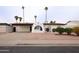 Charming single story home with desert landscaping, a water feature, and a cozy front porch at 1058 W Emelita Ave, Mesa, AZ 85210