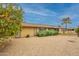 Backyard featuring desert landscaping, a covered patio, and privacy landscaping at 10726 W Pineaire Dr, Sun City, AZ 85351