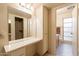 Vanity area with a sink, dressing table, and ample storage at 10726 W Pineaire Dr, Sun City, AZ 85351